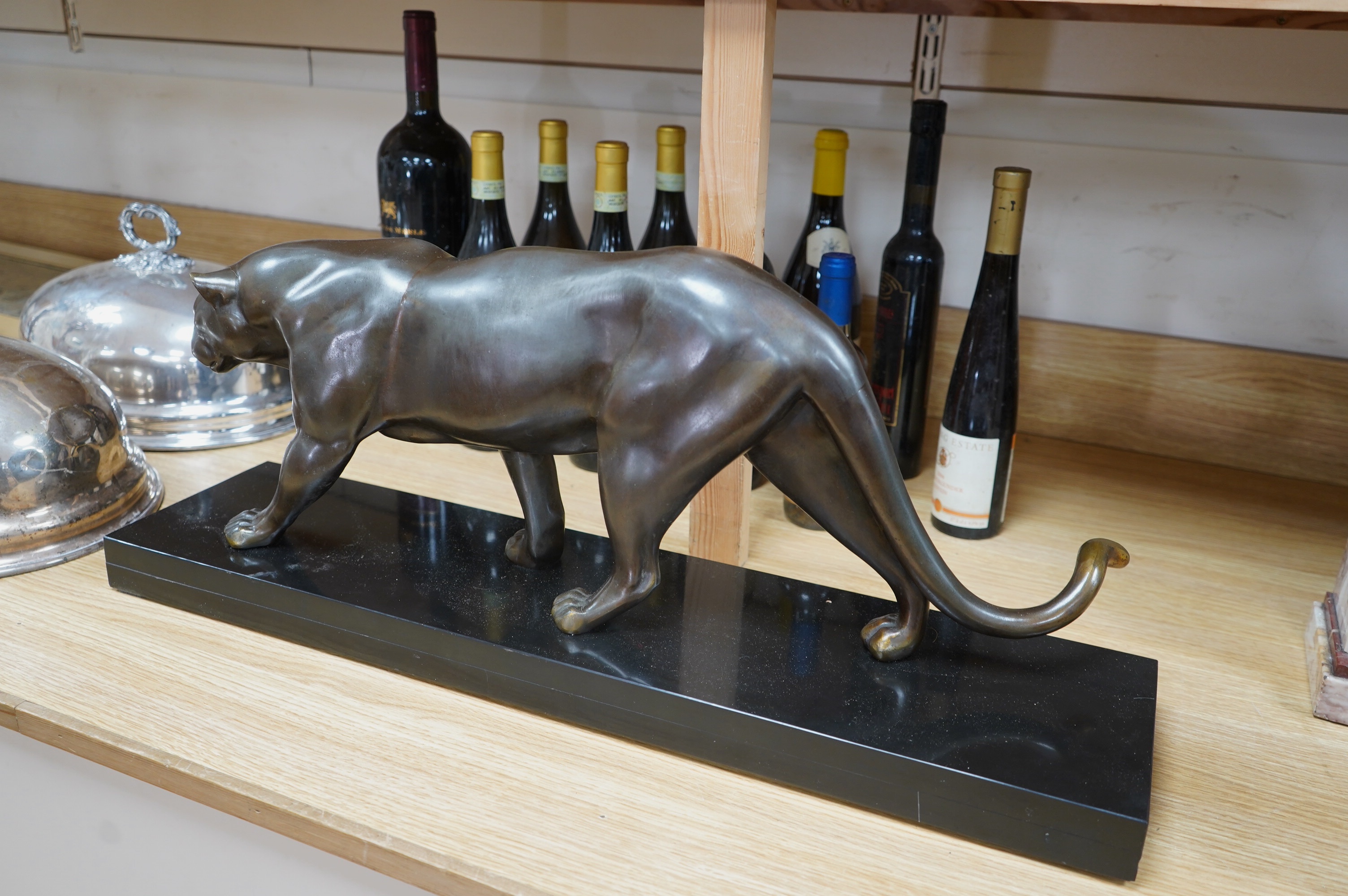 A large French Art Deco bronzed spelter panther, on black marble plinth, 71cm wide at base, 30cm high. Condition - good